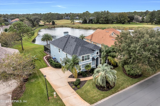 birds eye view of property with a water view