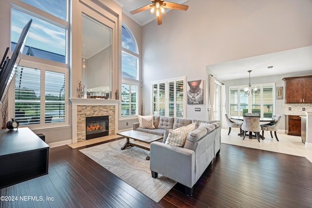 living room with a healthy amount of sunlight, dark hardwood / wood-style flooring, and a fireplace