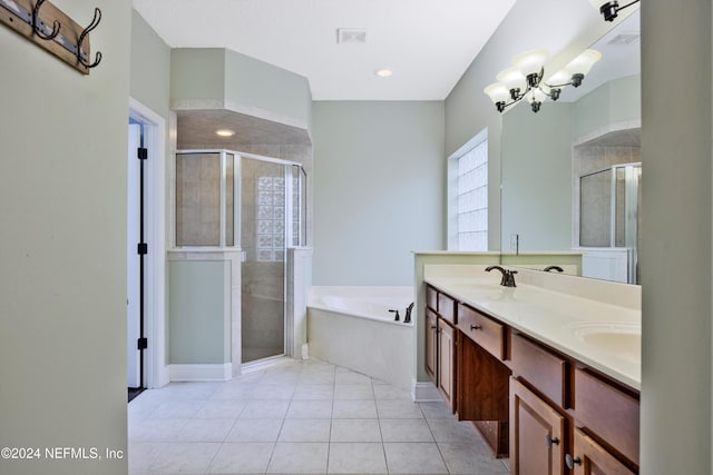 bathroom with separate shower and tub, tile patterned floors, vanity, and an inviting chandelier