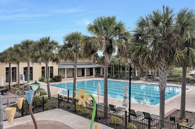 view of swimming pool with a patio area