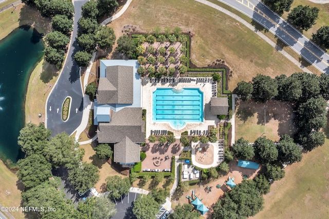 birds eye view of property with a water view