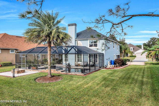 back of property with a lanai and a lawn