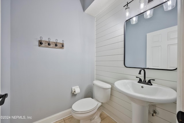 bathroom with tile patterned flooring and toilet