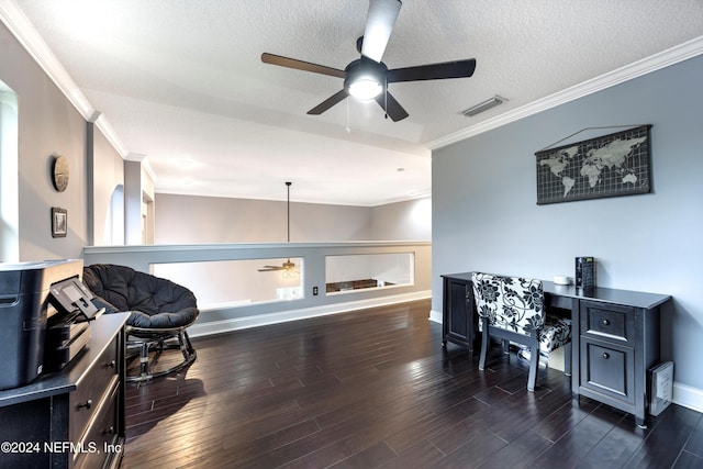 office space with dark hardwood / wood-style floors, ceiling fan, ornamental molding, and a textured ceiling