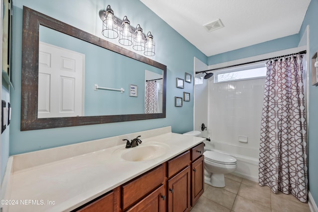 full bathroom featuring shower / bath combo, vanity, a textured ceiling, tile patterned flooring, and toilet