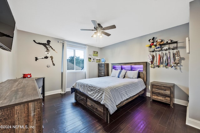 bedroom featuring ceiling fan and dark hardwood / wood-style flooring