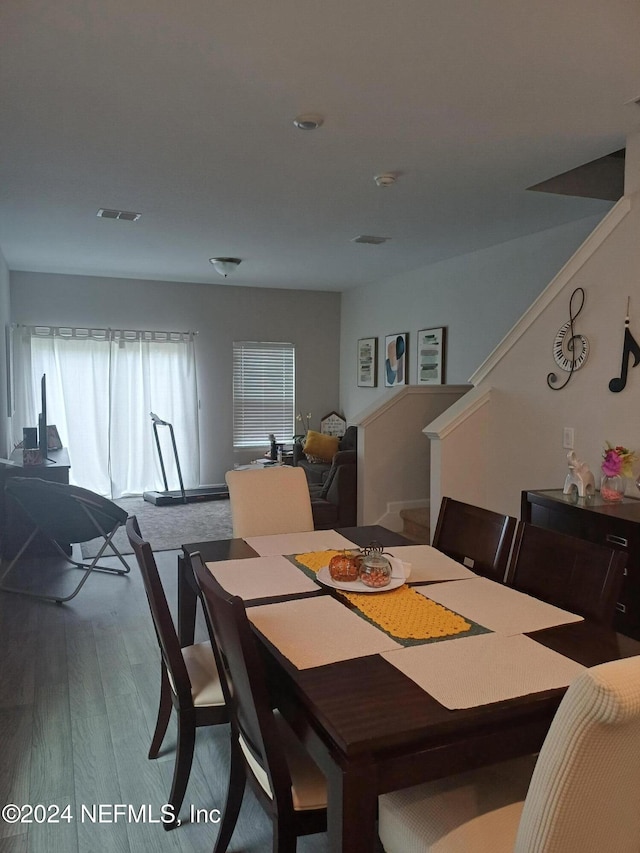 dining room with hardwood / wood-style flooring