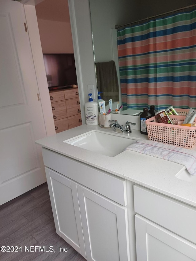 interior space featuring sink, white cabinets, and dark wood-type flooring