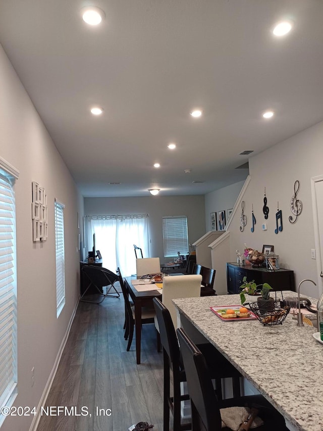 dining space featuring dark hardwood / wood-style floors