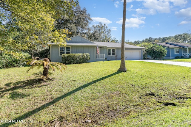 ranch-style house with a front yard and a garage