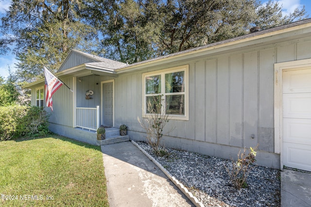 exterior space with a front yard and a porch