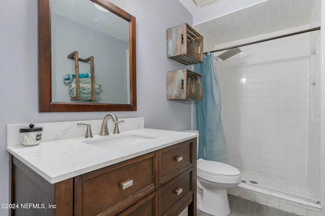 bathroom with a shower with shower curtain, vanity, wood-type flooring, and toilet