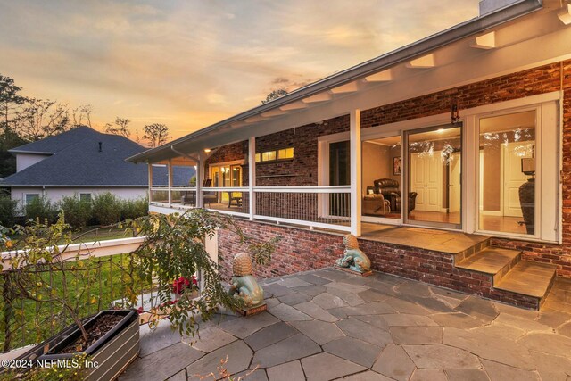 view of patio terrace at dusk