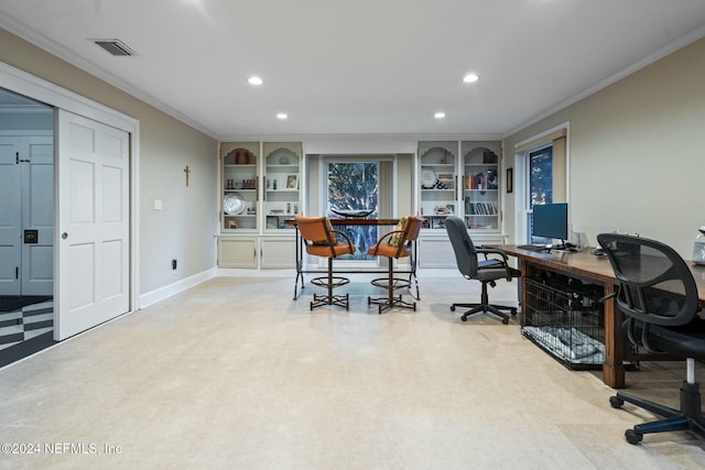 office area with light colored carpet and ornamental molding