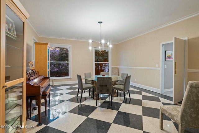 dining space with a chandelier and crown molding