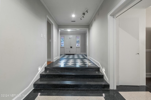 stairway featuring ornamental molding