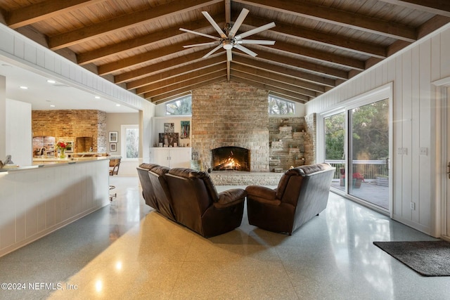 1124 Oriental Gardens Rd, Jacksonville, FL 32207 - living area with a brick fireplace, ceiling fan, a wood ceiling with exposed beams, high vaulted ceiling, and dark aggregate flooring