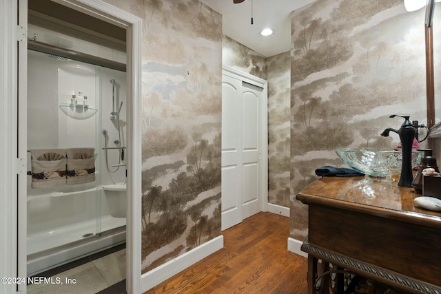 1124 Oriental Gardens Rd, Jacksonville, FL 32207 - bathroom featuring wood finished floors, vanity, and a shower