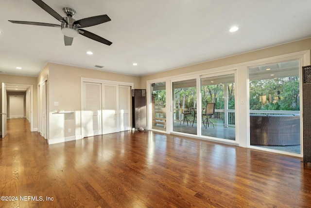 interior space with hardwood / wood-style flooring, a wealth of natural light, and ceiling fan