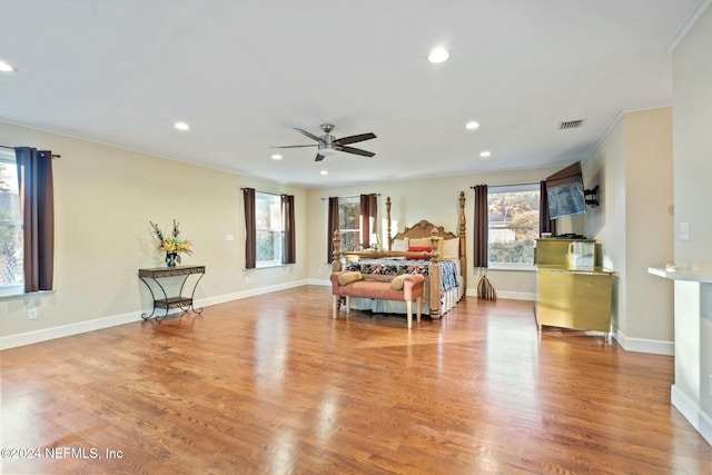 bedroom featuring crown molding and light hardwood / wood-style floors