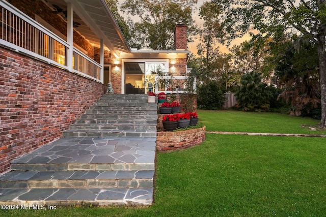 1124 Oriental Gardens Rd, Jacksonville, FL 32207 - yard at dusk featuring stairs and a yard