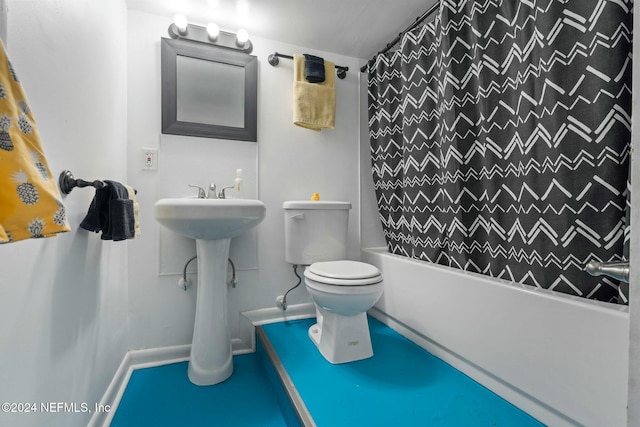 bathroom featuring shower / tub combo and toilet