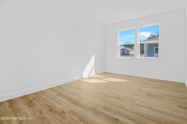 unfurnished room featuring light hardwood / wood-style flooring