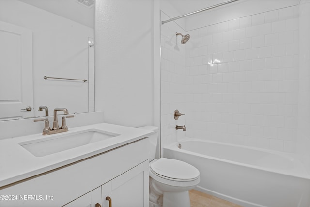 full bathroom with tile patterned floors, vanity, toilet, and tiled shower / bath combo