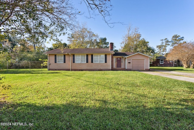 single story home featuring a front yard and a garage