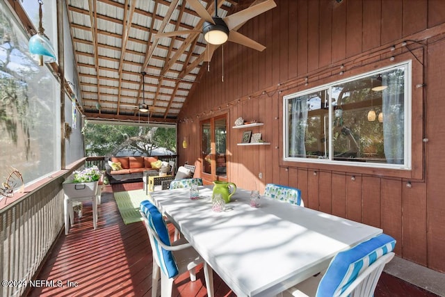 wooden terrace featuring ceiling fan and an outdoor living space