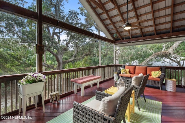 deck featuring ceiling fan and an outdoor hangout area