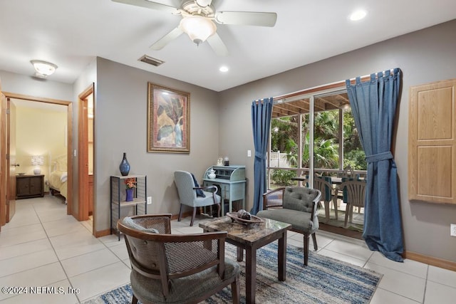 living area with ceiling fan and light tile patterned floors