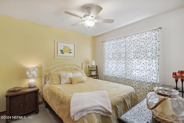 bedroom featuring ceiling fan and light tile patterned flooring