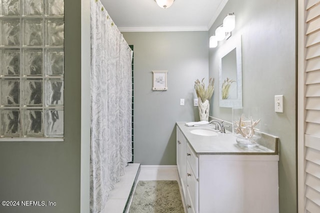 bathroom featuring tile patterned floors, walk in shower, vanity, and ornamental molding