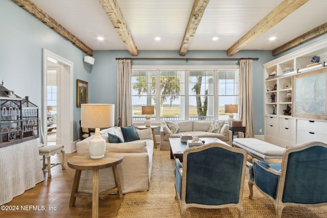 living room featuring hardwood / wood-style floors and beam ceiling