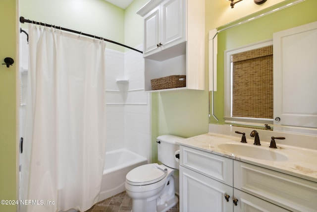 full bathroom with vanity, shower / bath combination with curtain, and toilet