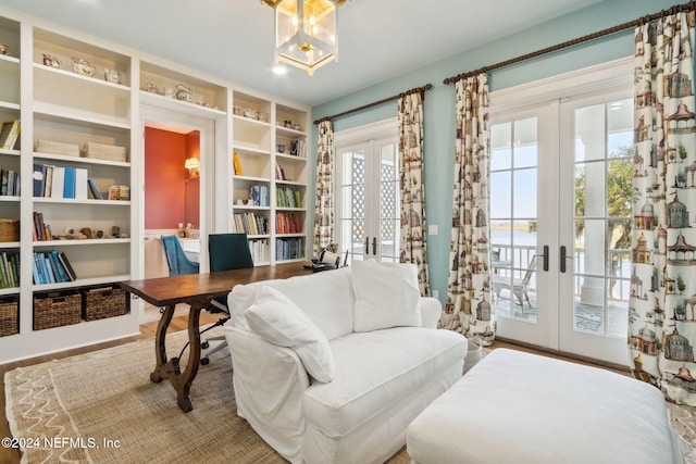 living area with french doors and wood-type flooring