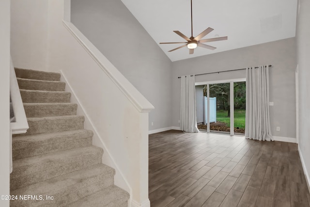 interior space with ceiling fan, high vaulted ceiling, and hardwood / wood-style floors