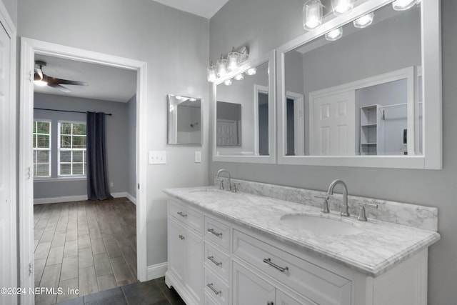 bathroom with vanity, wood-type flooring, and ceiling fan