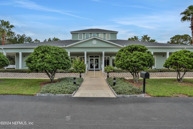 view of front of house featuring a porch and a front yard