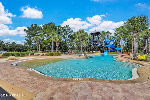 view of swimming pool featuring a water slide