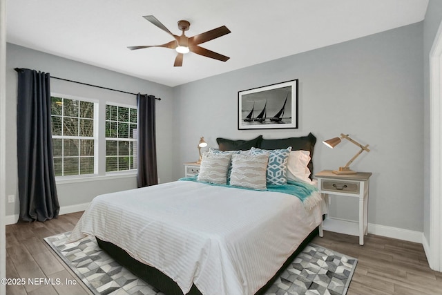 bedroom featuring ceiling fan and light hardwood / wood-style flooring