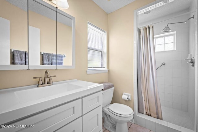 bathroom featuring vanity, tile patterned floors, a shower with shower curtain, toilet, and a textured ceiling