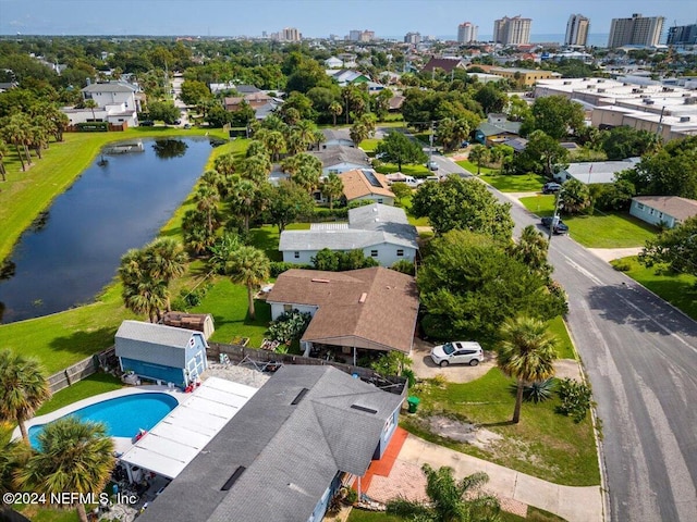 birds eye view of property with a water view