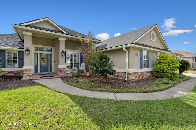 single story home featuring a front yard