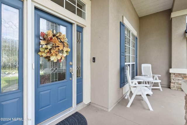 entrance to property featuring a porch