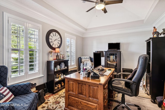 office area with ceiling fan, a raised ceiling, light wood-type flooring, and crown molding