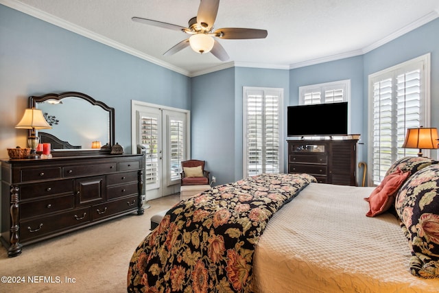 bedroom featuring ceiling fan, light colored carpet, ornamental molding, and a textured ceiling