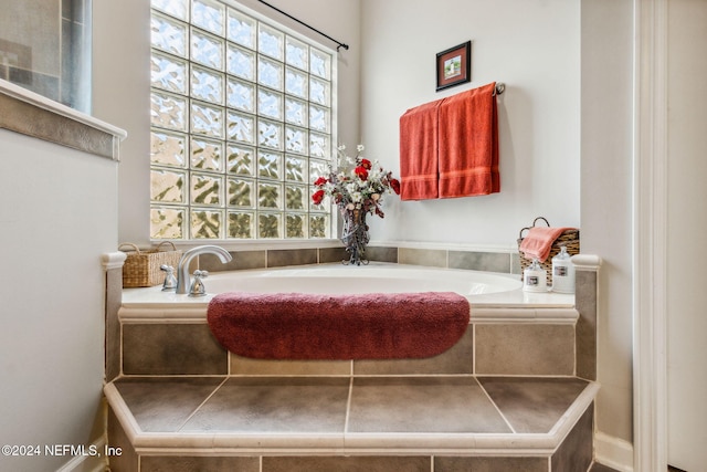 bathroom featuring tiled bath