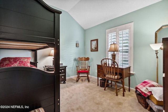 bedroom featuring light carpet and vaulted ceiling